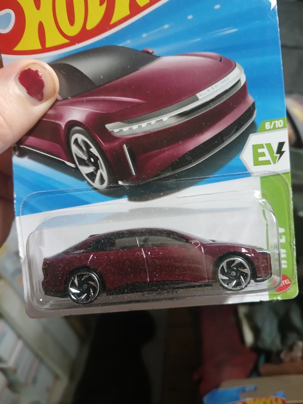 the Hot Wheels Lucid Air in Zenith/Wine Red from the 2026 mainline series (HW EV
